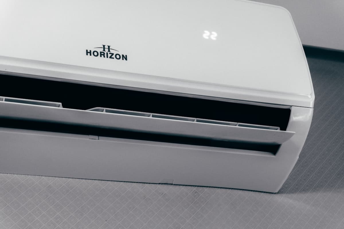 Modern split system air conditioner showing 22 degrees on digital display