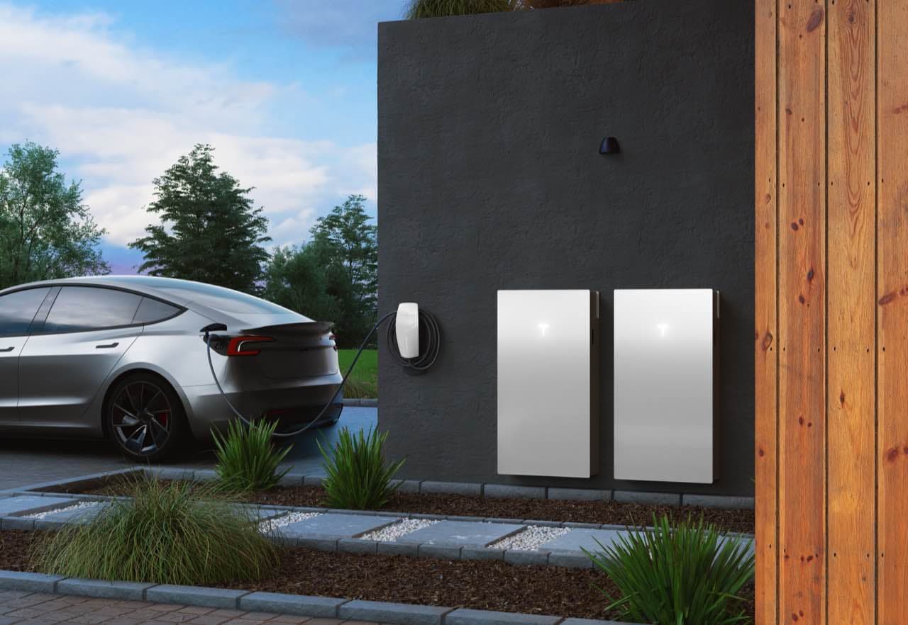 Tesla electric vehicle charging at home with dual Powerwall batteries
